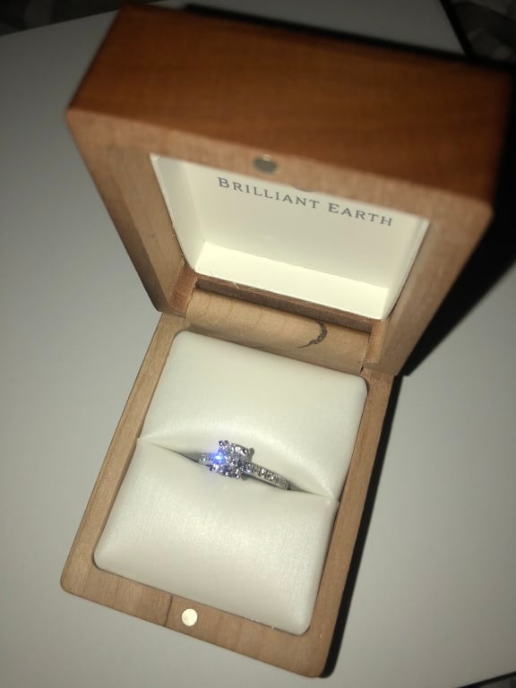 Oval diamond ring on hand