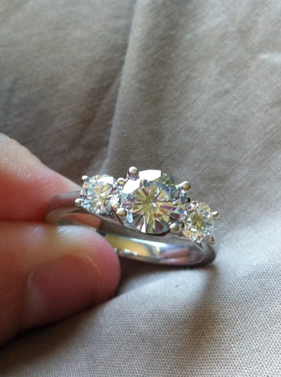 Oval diamond ring on hand
