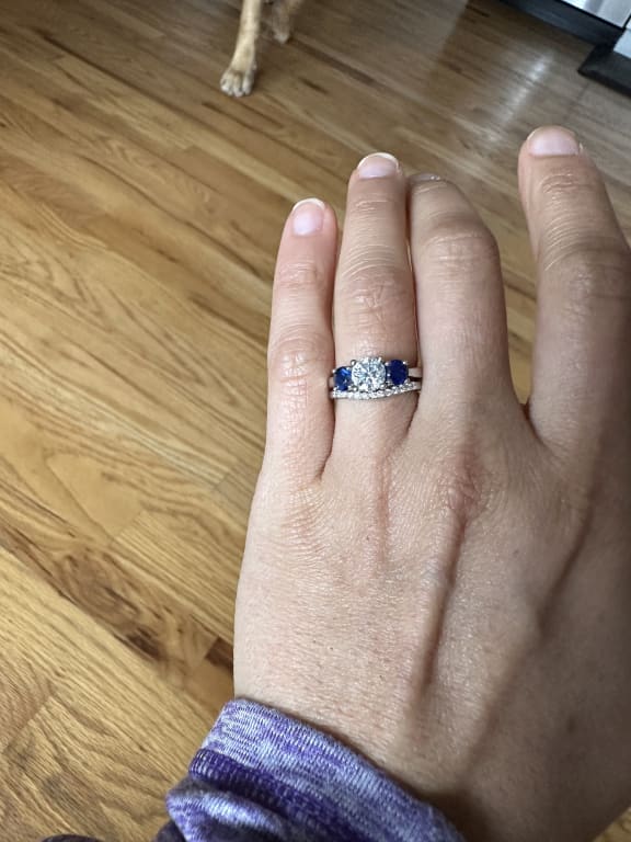 Oval diamond ring on hand