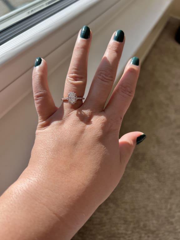 Oval diamond ring on hand