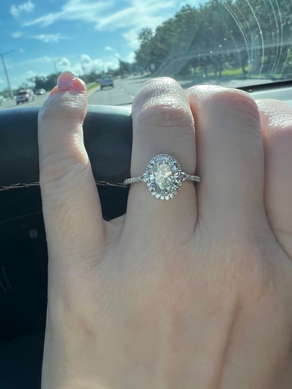 Oval diamond ring on hand