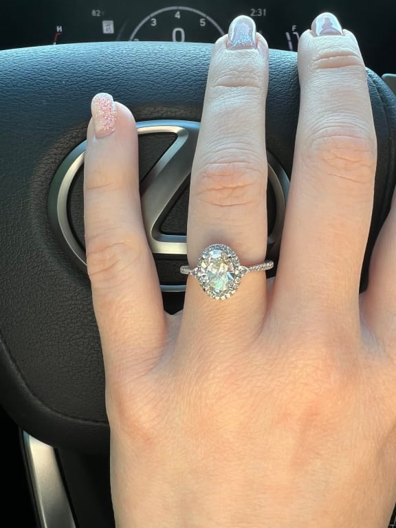 Oval diamond ring on hand