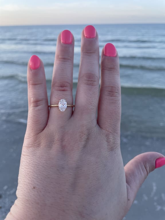 Oval diamond ring on hand