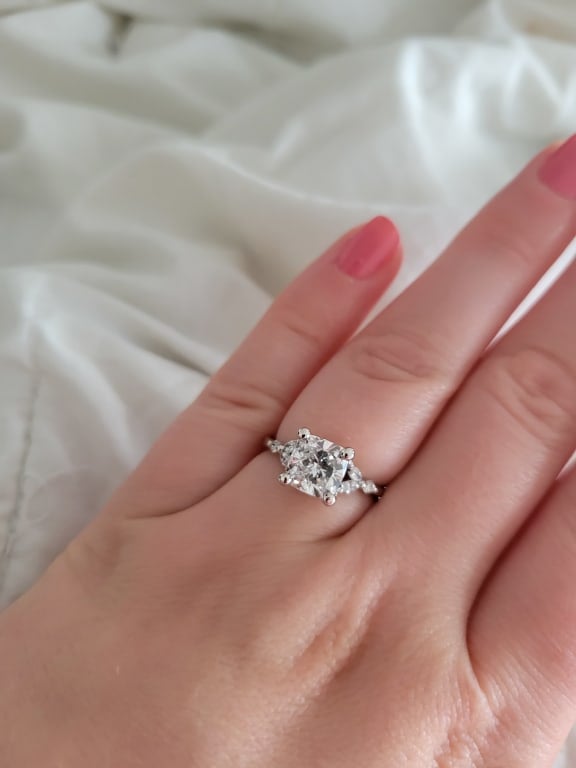 Oval diamond ring on hand