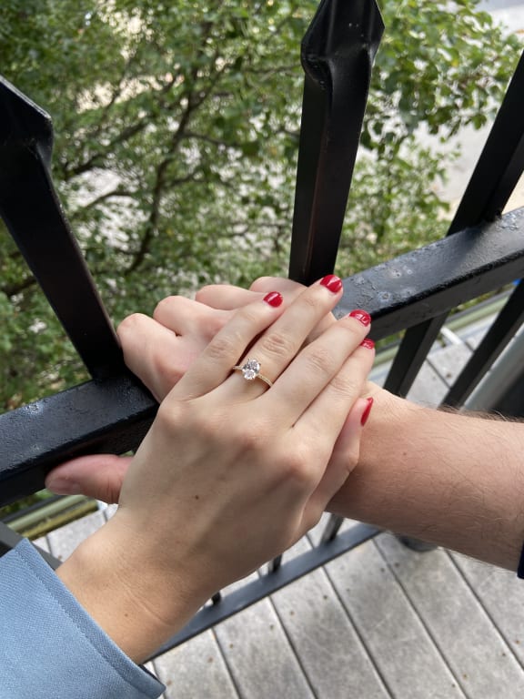 Oval diamond ring on hand