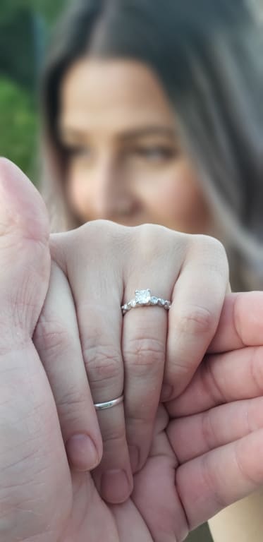 Oval diamond ring on hand