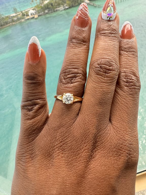 Oval diamond ring on hand