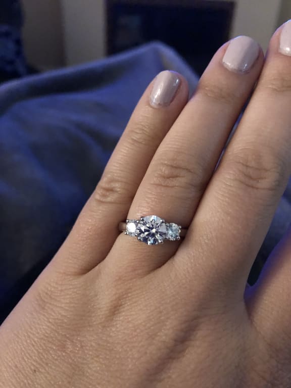 Oval diamond ring on hand