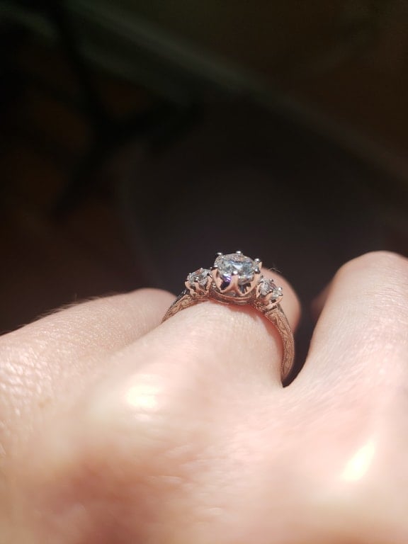 Oval diamond ring on hand