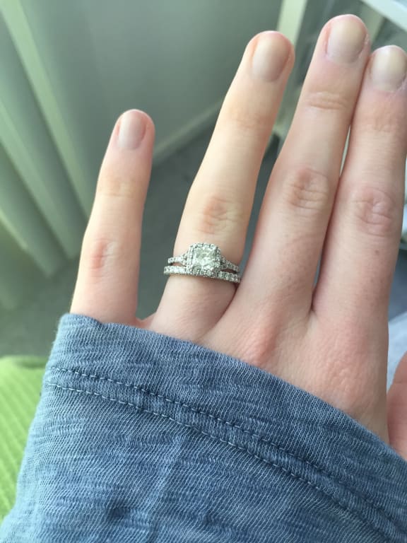Oval diamond ring on hand