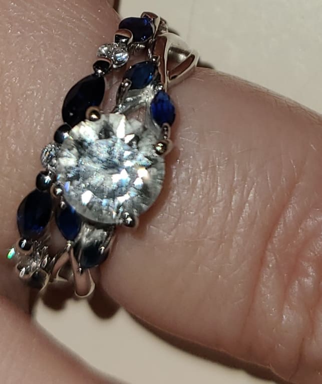 Oval diamond ring on hand