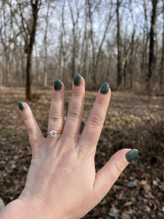 Oval diamond ring on hand