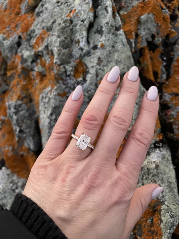 Oval diamond ring on hand