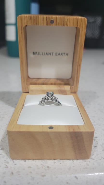 Oval diamond ring on hand