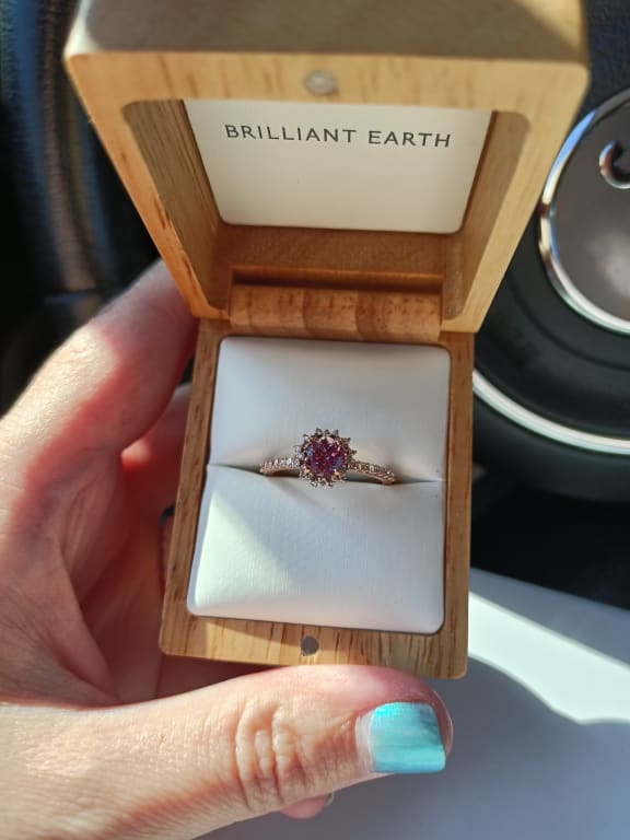 Oval diamond ring on hand