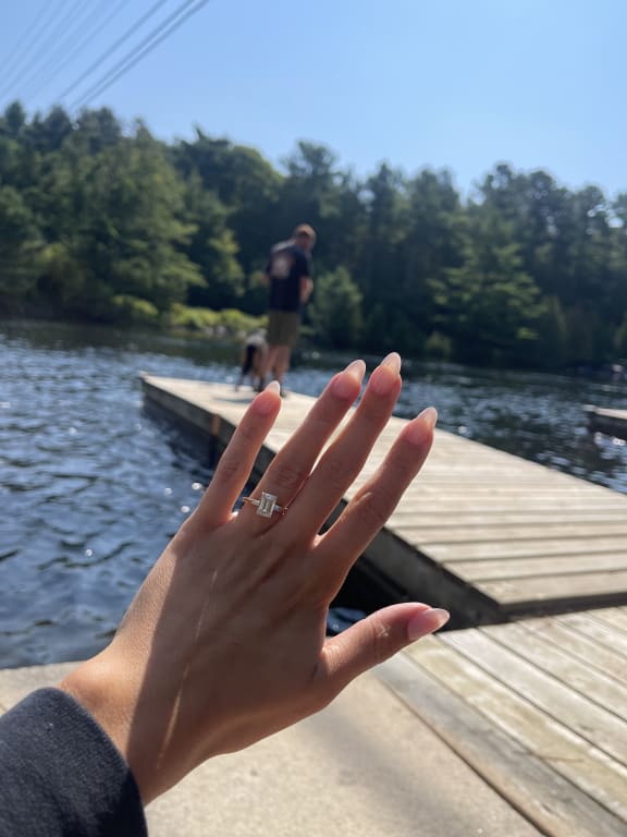 Oval diamond ring on hand