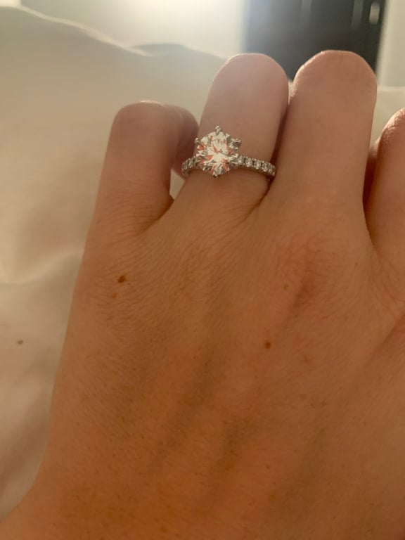 Oval diamond ring on hand