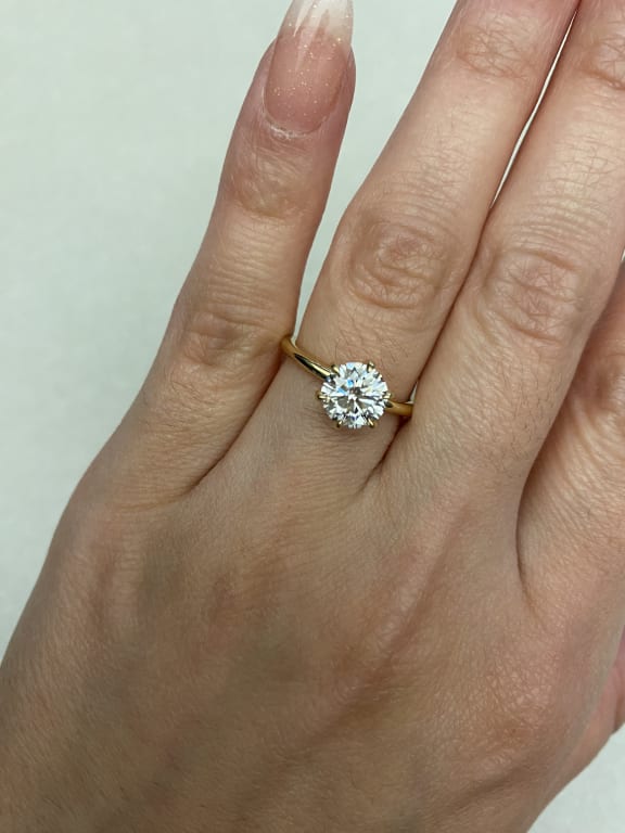 Oval diamond ring on hand