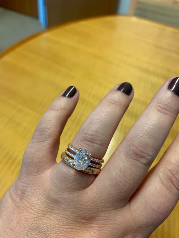 Oval diamond ring on hand