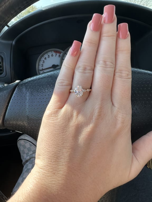 Oval diamond ring on hand