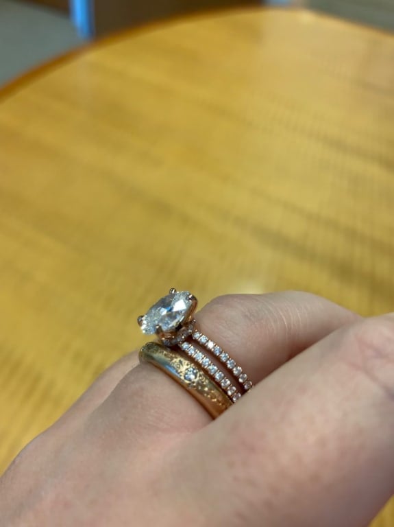 Oval diamond ring on hand