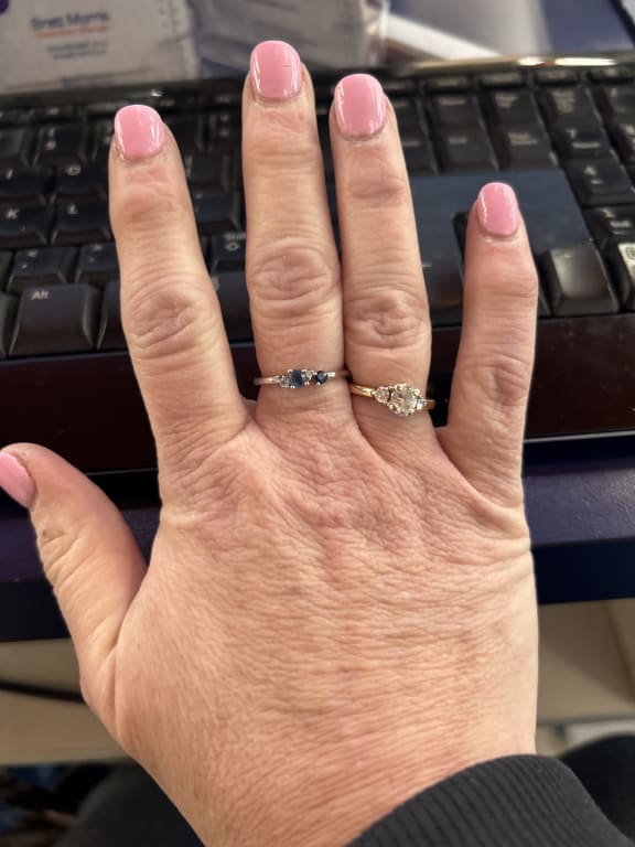 Oval diamond ring on hand