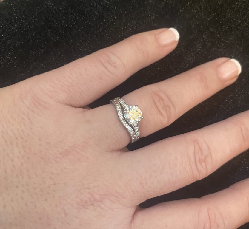 Oval diamond ring on hand