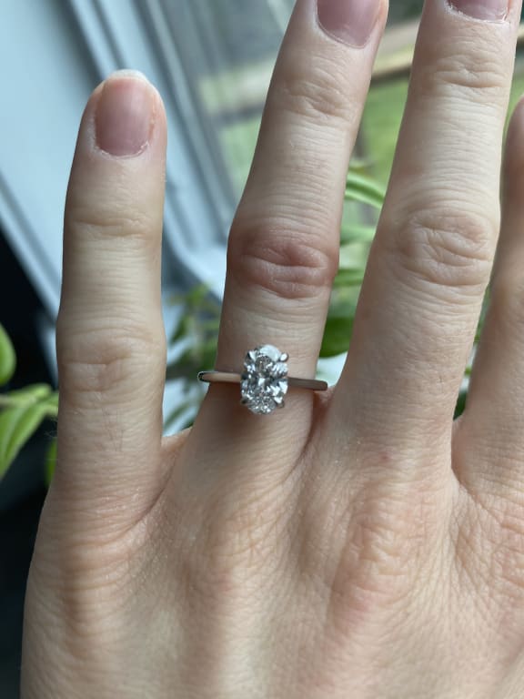 Oval diamond ring on hand