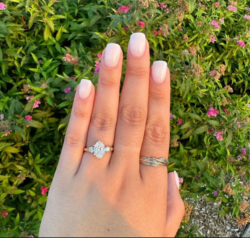 Oval diamond ring on hand