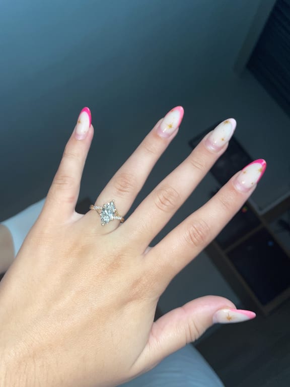 Oval diamond ring on hand