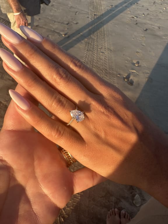 Oval diamond ring on hand