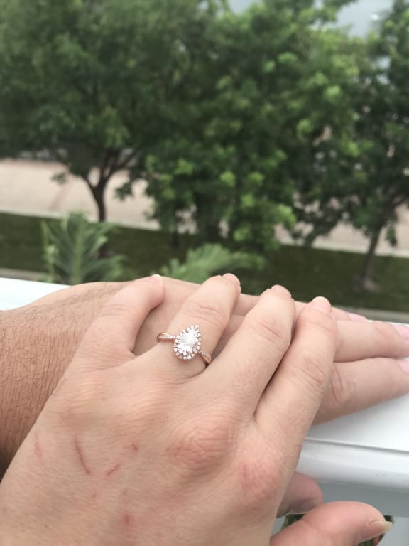 Oval diamond ring on hand