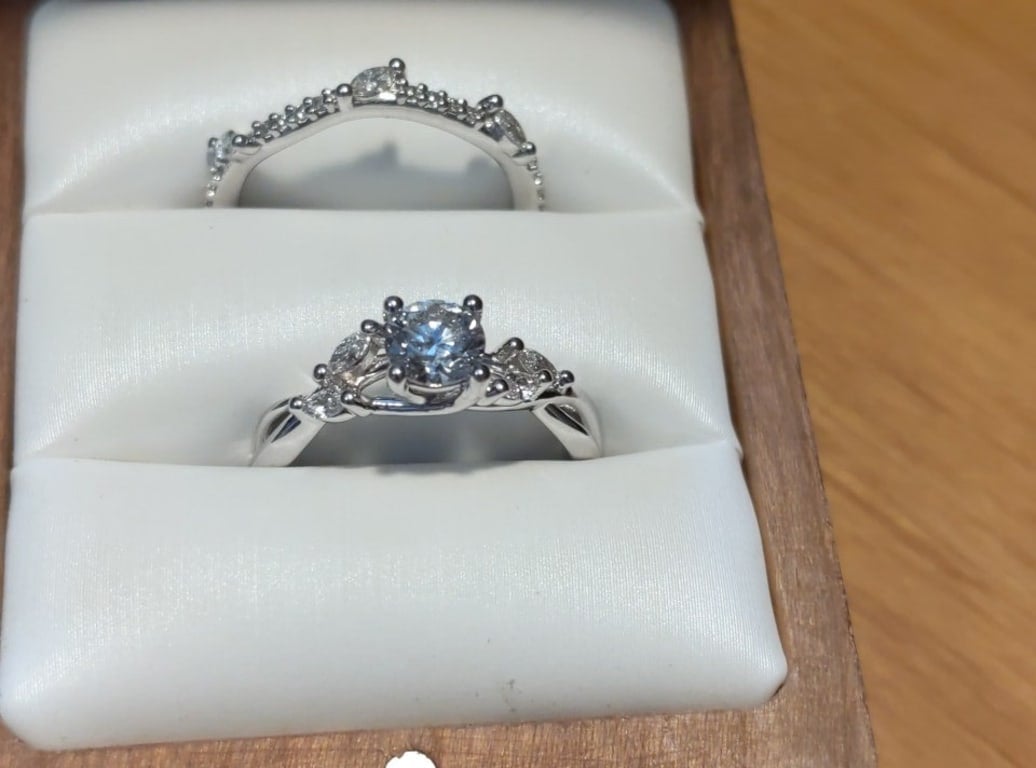 Oval diamond ring on hand