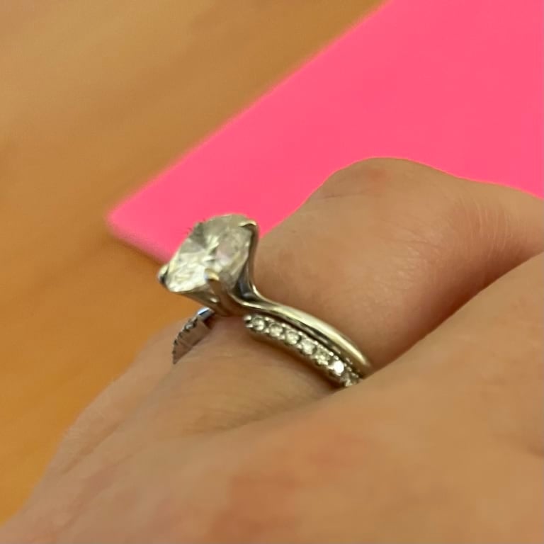 Oval diamond ring on hand