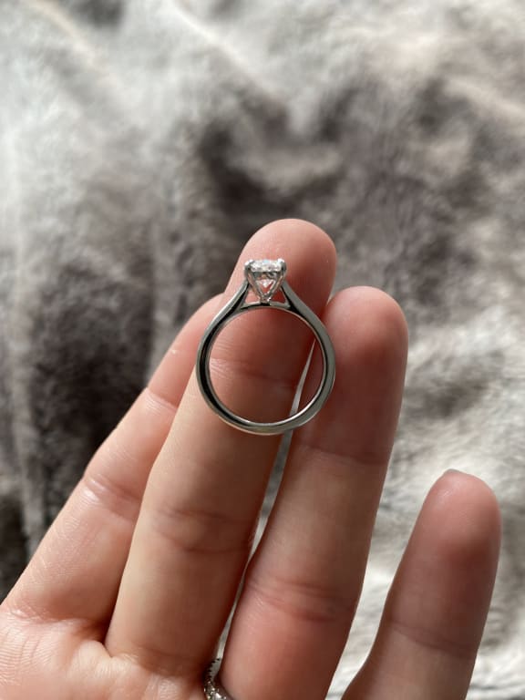 Oval diamond ring on hand