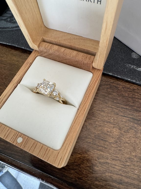 Oval diamond ring on hand