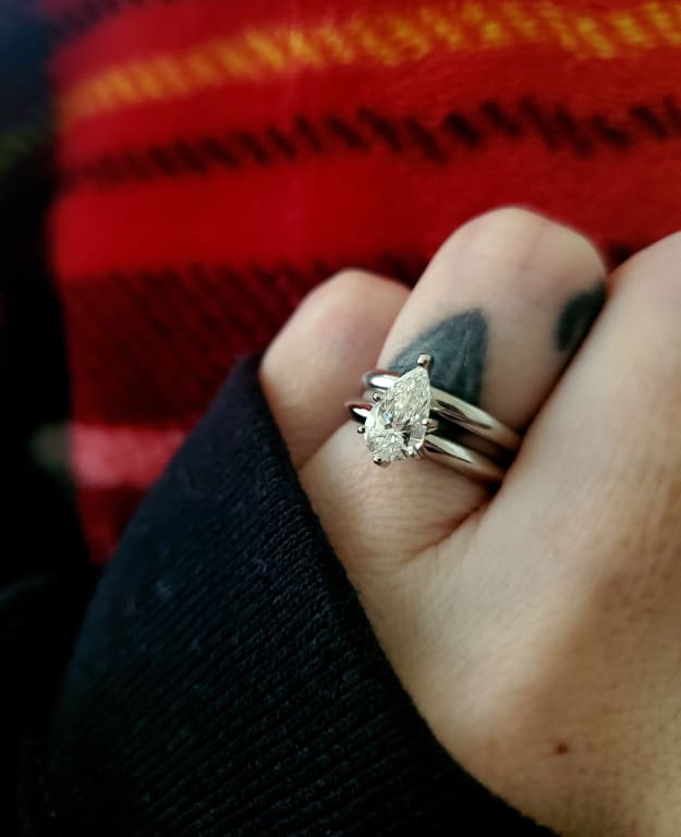 Oval diamond ring on hand