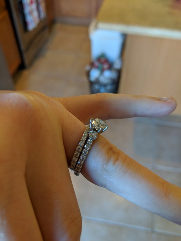 Oval diamond ring on hand
