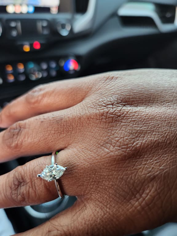 Oval diamond ring on hand
