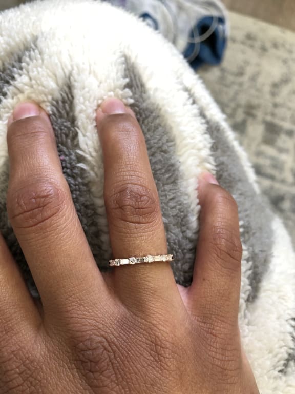 Oval diamond ring on hand