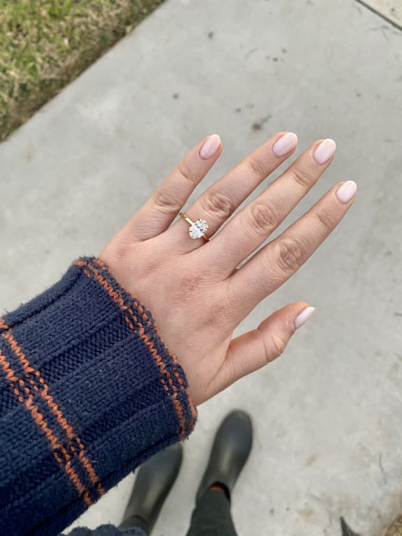 Oval diamond ring on hand