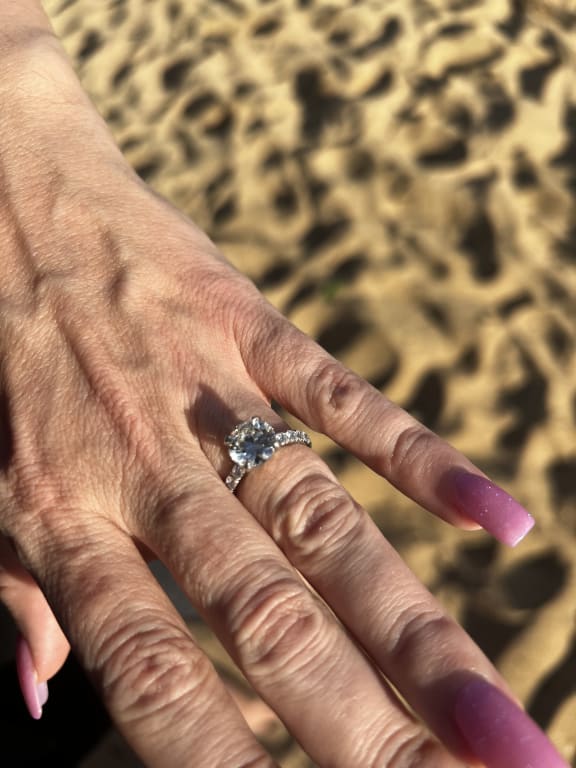 Oval diamond ring on hand