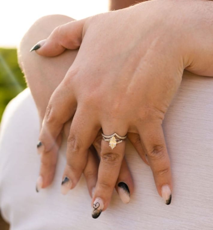 Oval diamond ring on hand