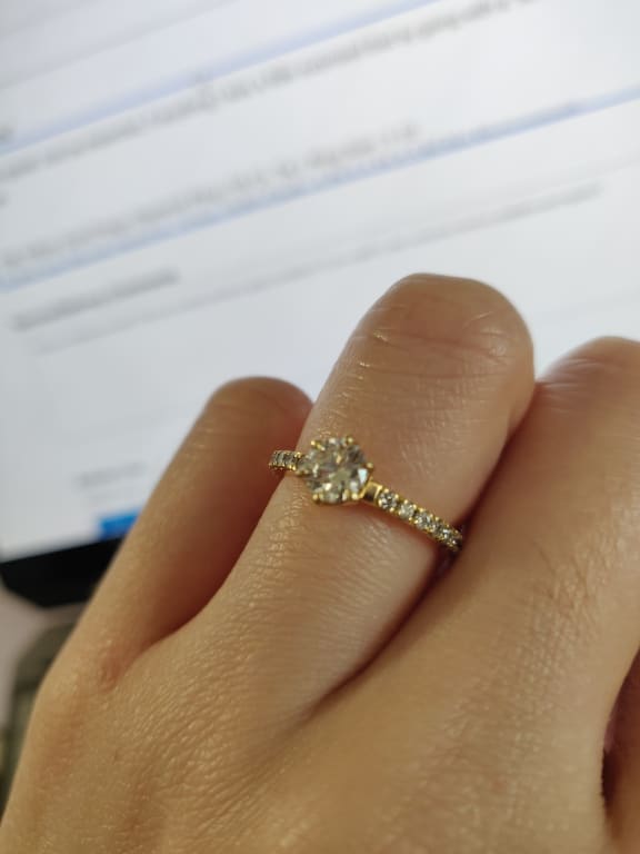Oval diamond ring on hand