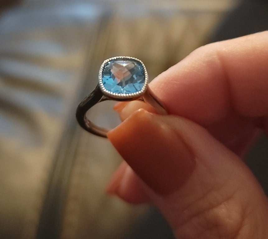 Oval diamond ring on hand