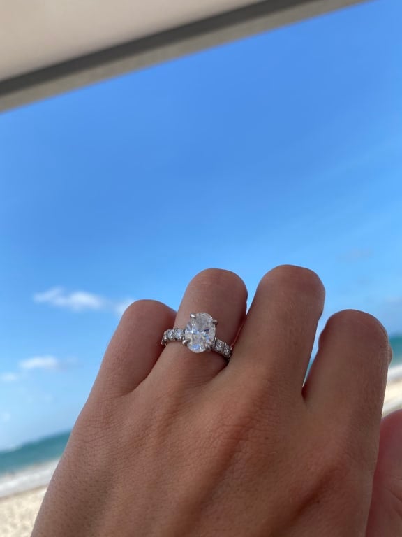 Oval diamond ring on hand