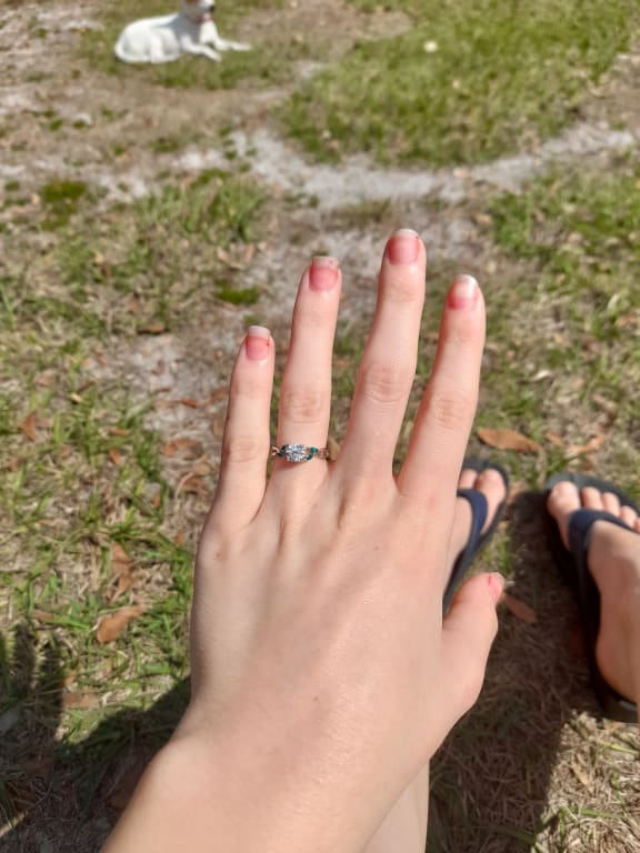 Oval diamond ring on hand