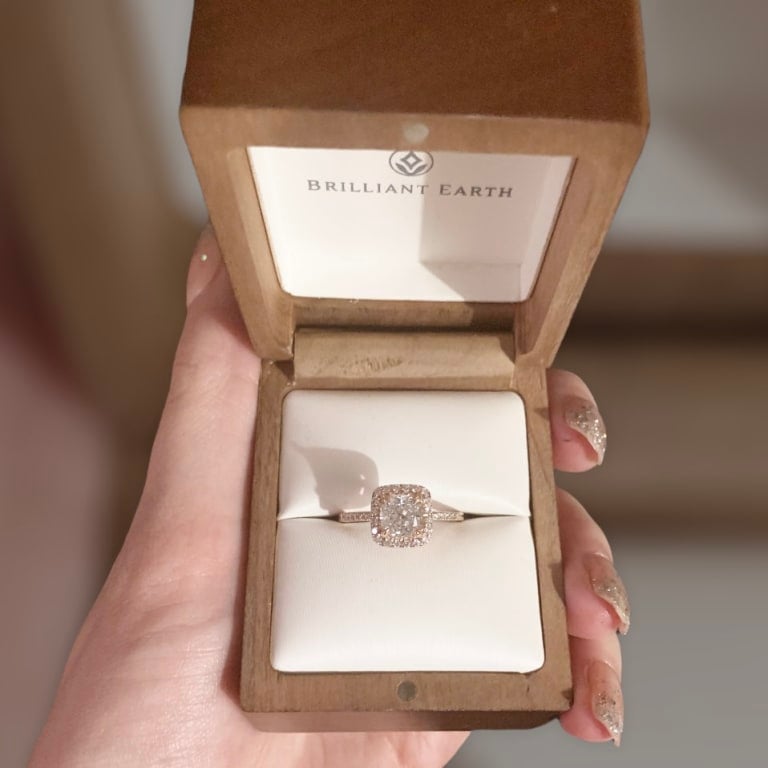 Oval diamond ring on hand