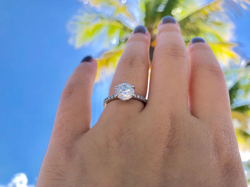 Oval diamond ring on hand
