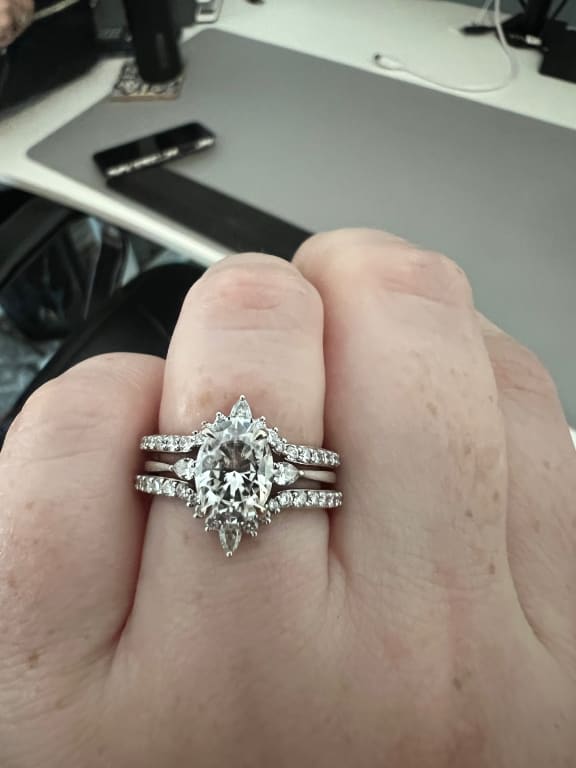 Oval diamond ring on hand